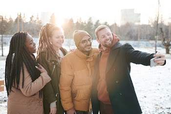 People Taking A Group Picture
