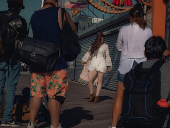 People Taking Photo of a Woman