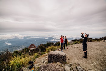 people Taking Photographs On A Plateau