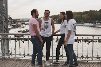 People Talking Each Other Near Body of Water