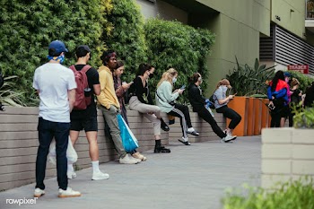 People using their phones and having social distancing while line up d.. | Free  photo - 2311374