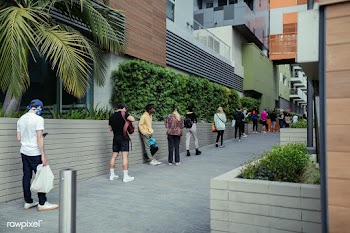 People using their phones and having social distancing while line up d.. | Free  photo - 2311958