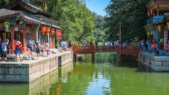 People Visiting A Tourist Destination By The River