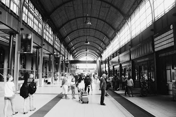 People Walking Along Tiled Floor Building