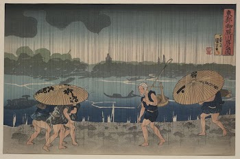 People walking beneath umbrellas along | Free Photo - rawpixel
