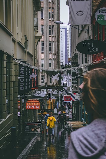 People Walking Between Buildings