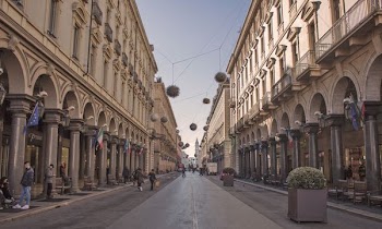 people walking between buildings during daytime