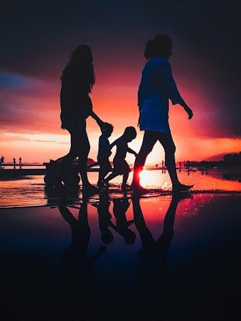 People Walking By Th Beach