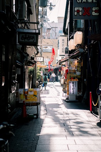 People Walking in An Alley