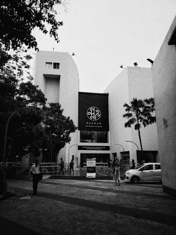People Walking in Front of Building during Day