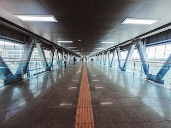 People Walking Inside Tunnel