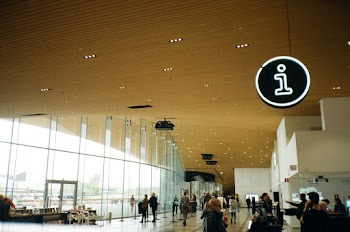 People Walking Inside Well-lit Building