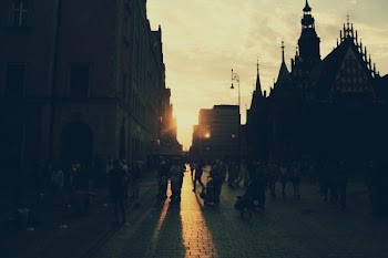 People Walking Near Building during Golden Hour
