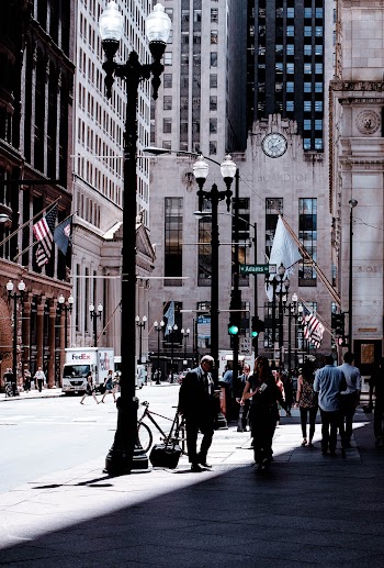 People Walking Near Concrete Building