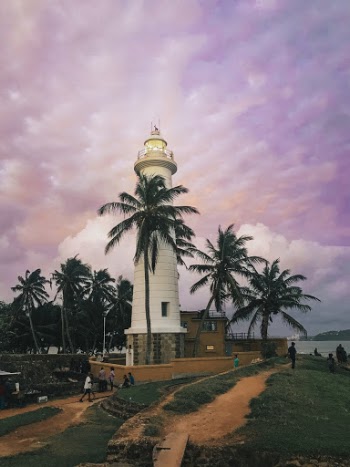 People Walking Near Lighthouse