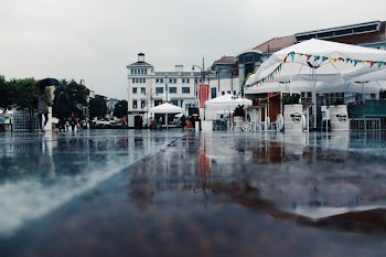 People Walking Near Tents during Rain