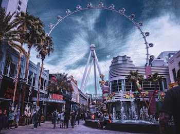 People Walking on Amusement Park Near Buildings