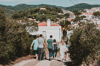 People Walking on Dirt Road