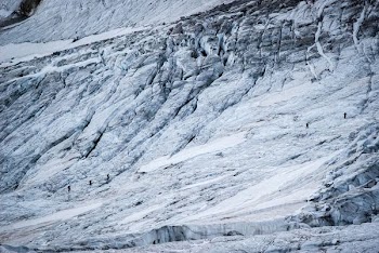 people walking on mountain during snow