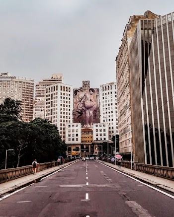 People Walking on Pathway Near Buildings 
