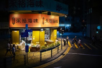 People Walking on Sidewalk and Road
