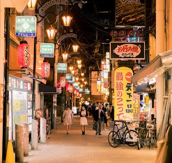 People Walking on The  Street At Nighttime