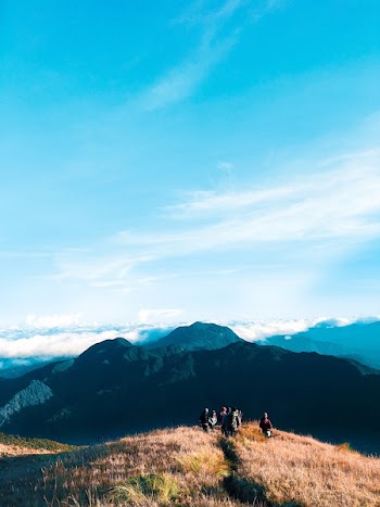 People Walking on Top of Mountain