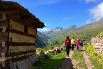 People Walking on Trail at Mountain Side