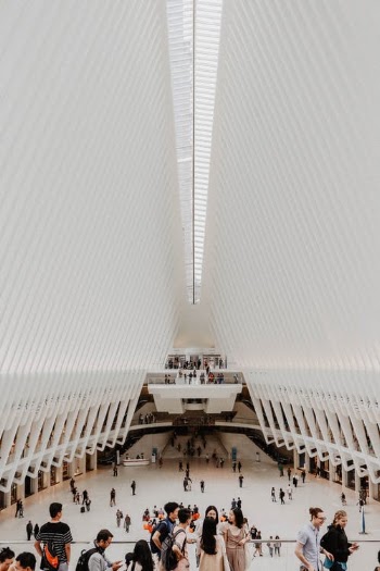 People Walking on White Building · Free Stock Photo