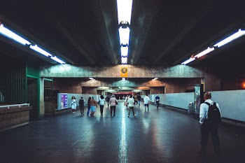 People Walking Through an Underpass