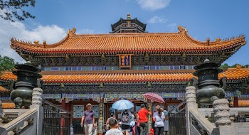 People Walking To A Palace