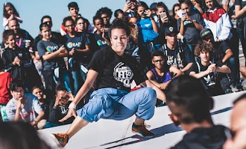 People Watching A Woman Dancing Hip Hop