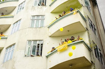 People Watching From A Balcony Of Building