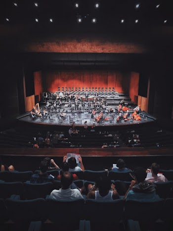 People Watching Play on Stage