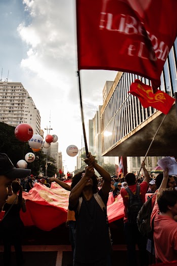 People Waving Red Flag