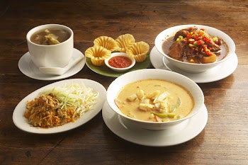 peranakan or nyonya foood on wooden table