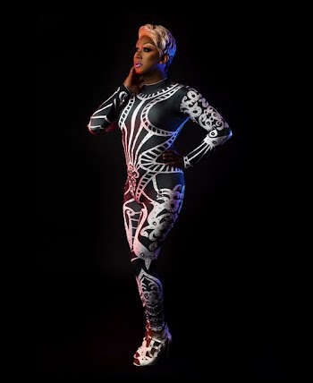 Performer Posing In Red And Blue Light