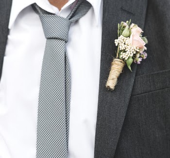 Person's Black Suit Jacket