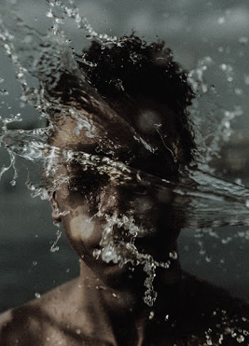 Person's Face and Water Splash