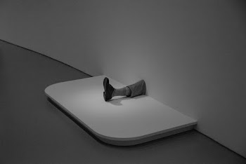 Person's Feet on White Wall