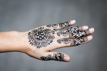 Person's Flower Hand Tattoo