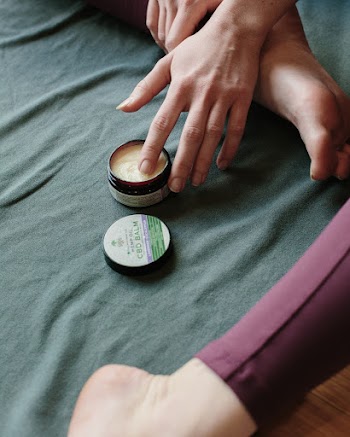 Person's Hand in a Wax Container