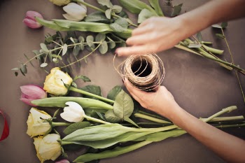 Person's Hand Near Flowers