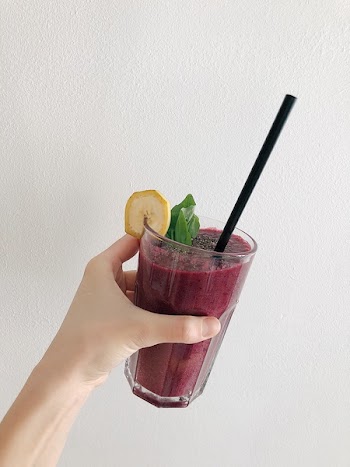 Person's Holding Fruit Drink