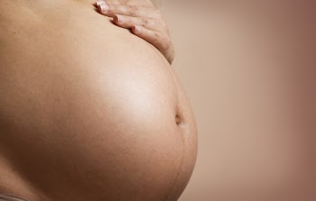 Person's Tummy And Hand