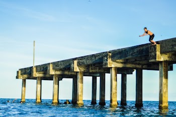 Person About to Jump on Dock