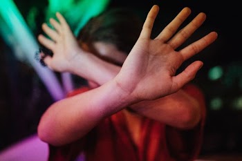 person avoiding to photo face