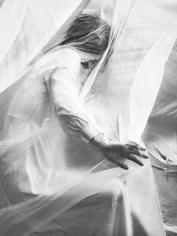 person behind white curtain