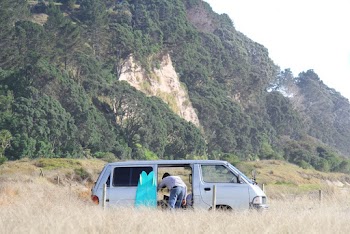 Person Bending Forward Inside Van