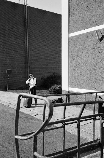 Person Beside Building